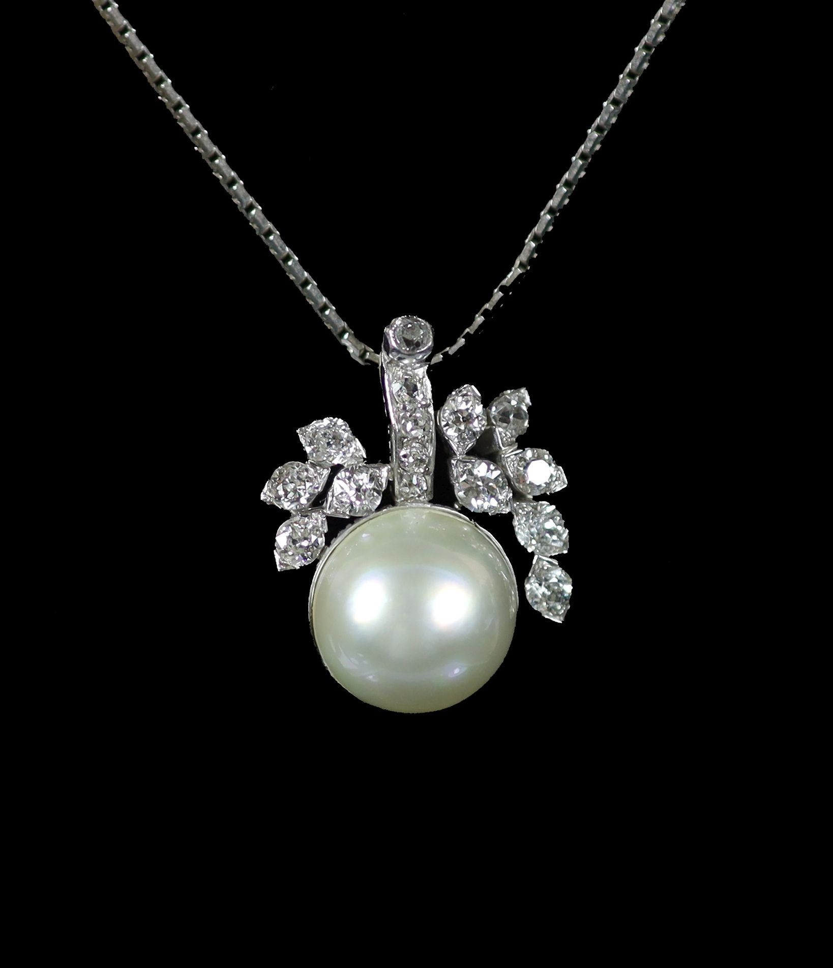 A white gold, mabe pearl and diamond cluster set pendant